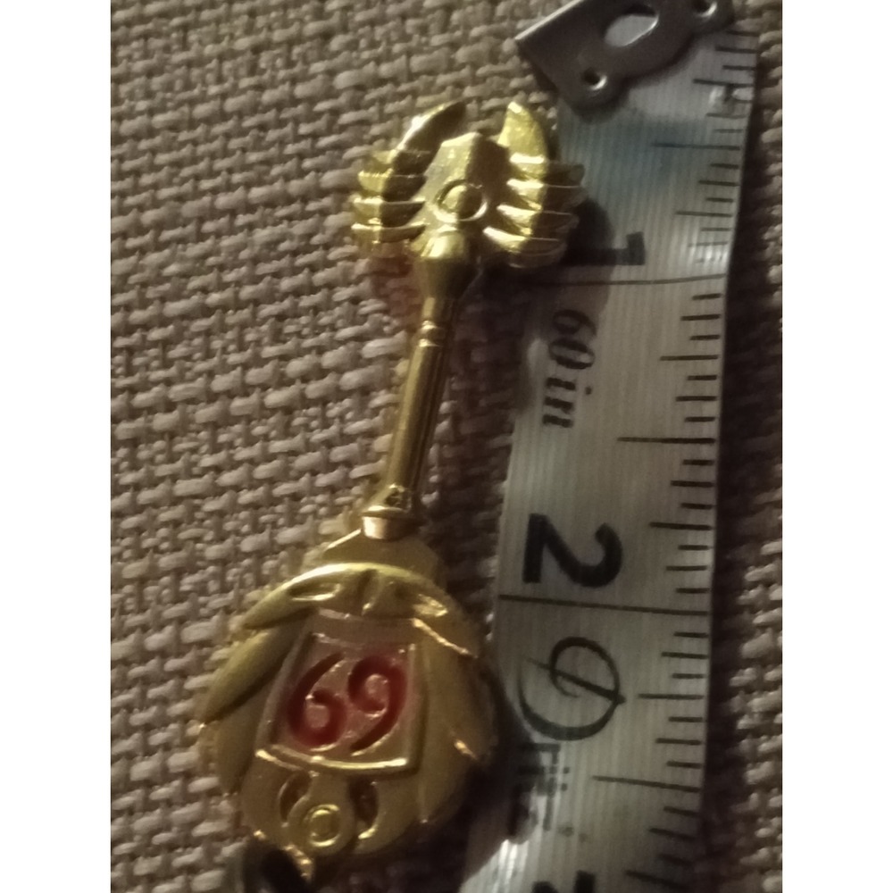 Gold Tone Metal Key Chain with Red Enamel 69 and Wings Design
